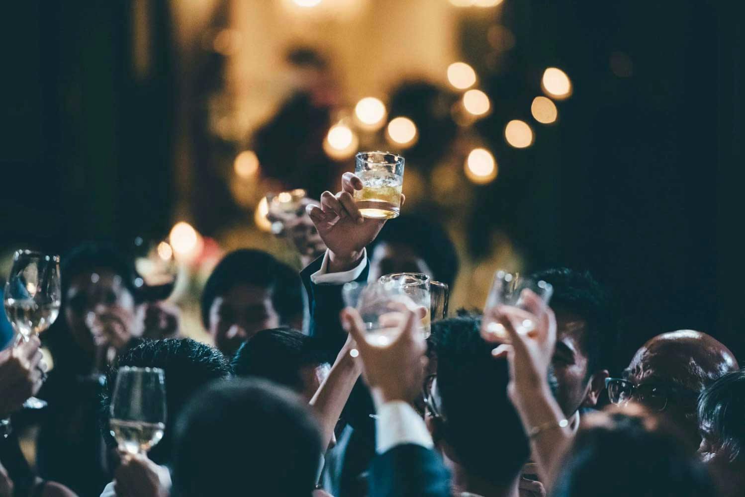 wedding guests toast glass shot best wedding photographer in singapore actual day