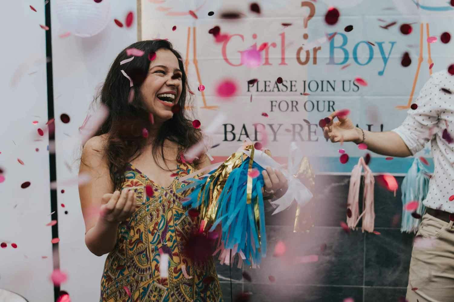 soon to be mother laughs heartily during her gender reveal party private event photography in singapore
