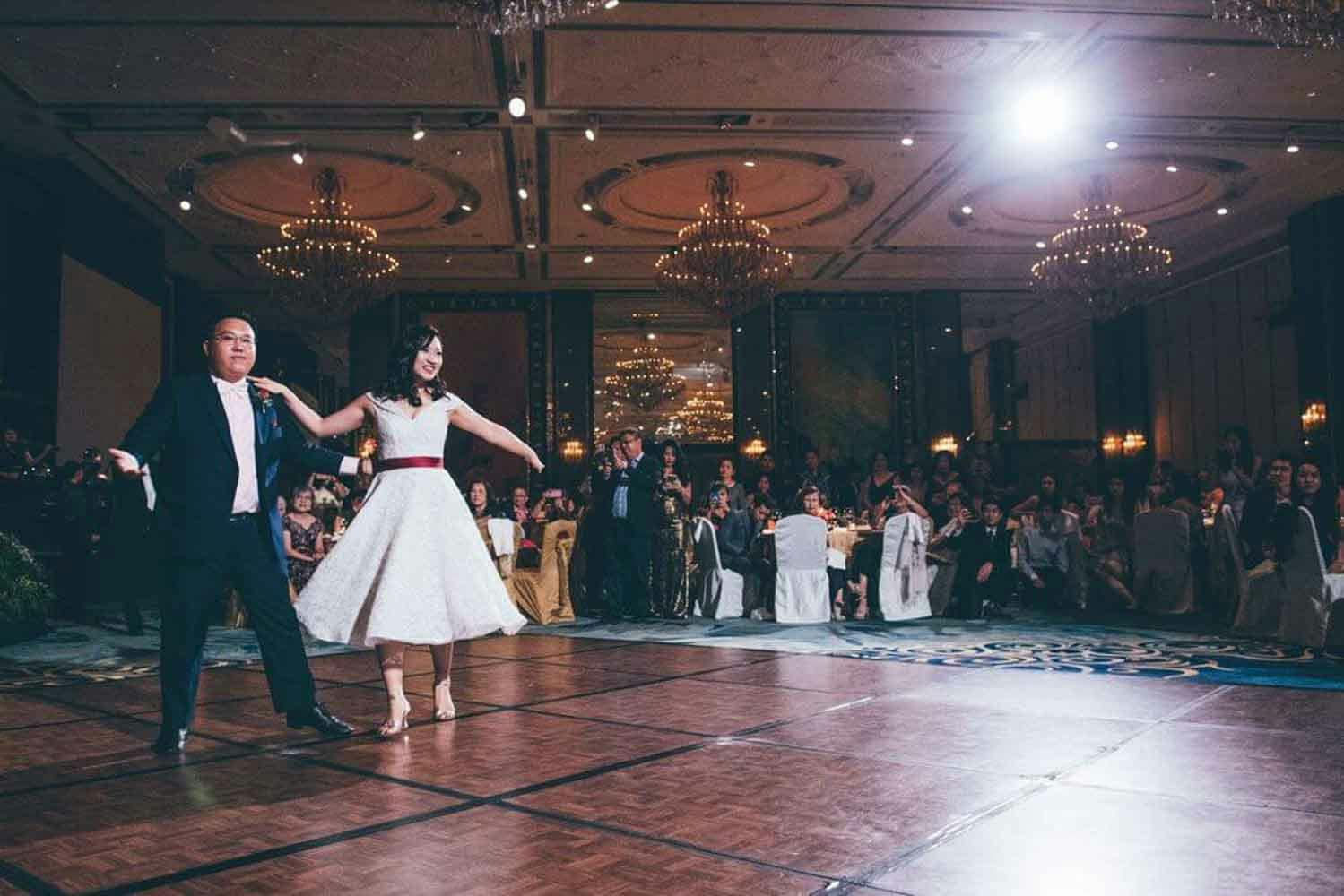 bride and groom dancing in the ballroom hotel best wedding photographer in singapore actual day