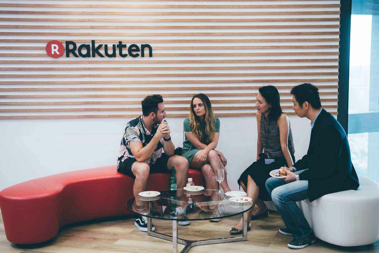 rakuten symposium at rakuten singapore office a group of four sitting under the rakuten logo