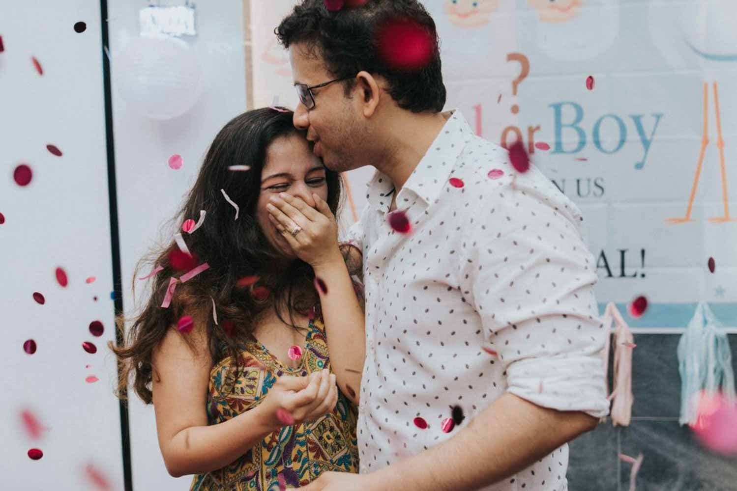 soon to be mother laughs heartily during her gender reveal party private event photography in singapore