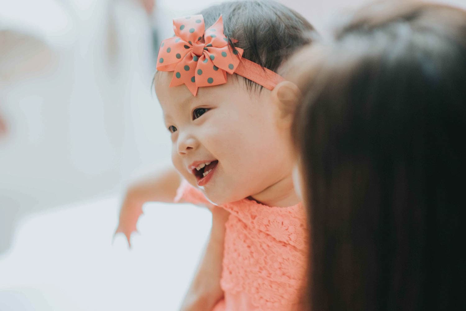 1-year-old baby kid smiling at party celebration shot by professional event photographer in singapore
