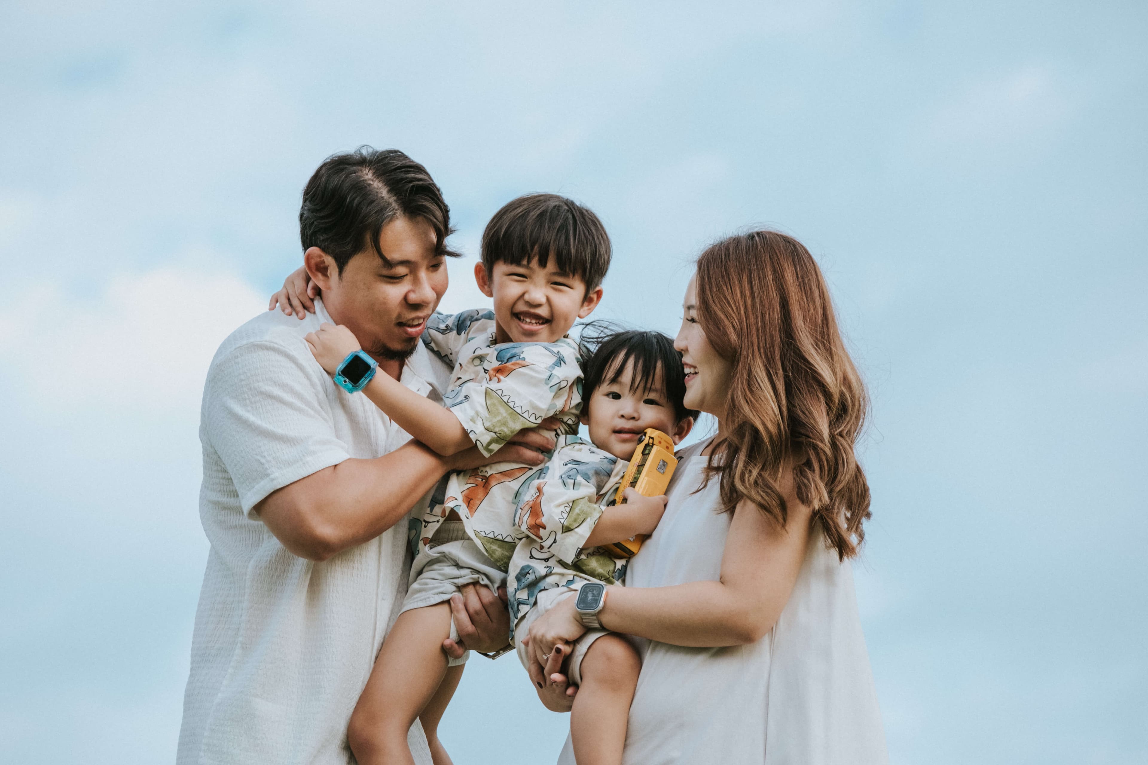 smiling and happy family during an outdoor photoshoot in singapore