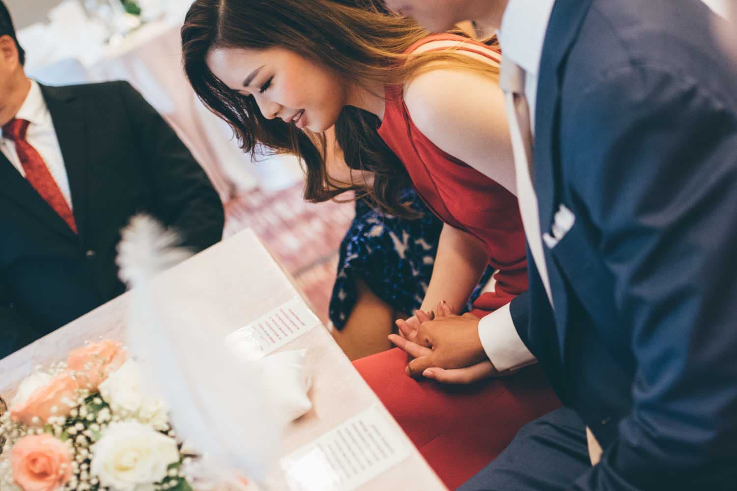 bride and groom holding hand during solemnisation actual wedding day photography singapore