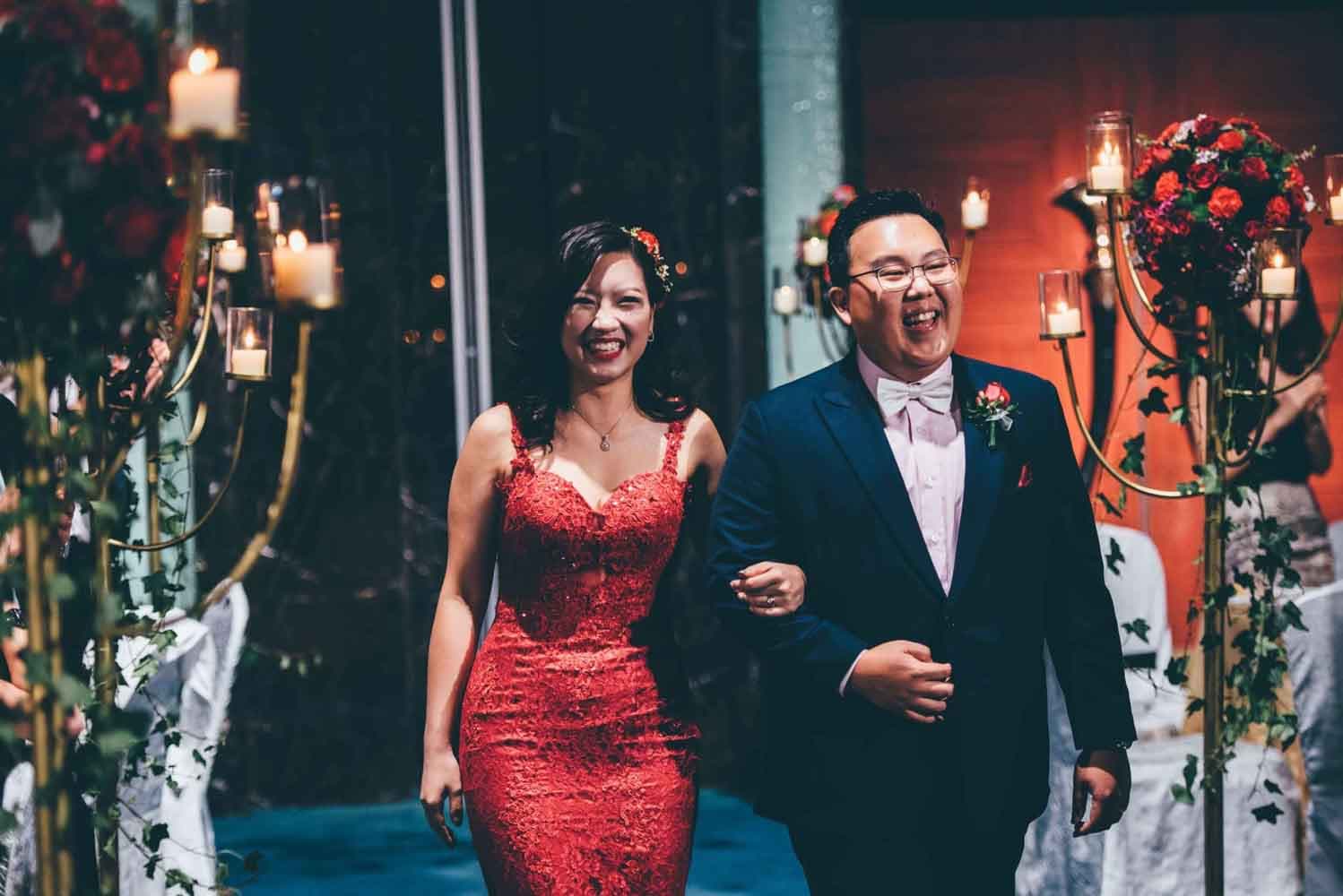 bride and groom wedding march in hotel best wedding photographer in singapore actual day