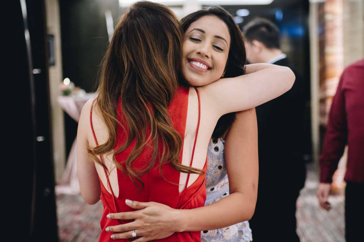 bride hugging best friend at wedding actual day singapore photography