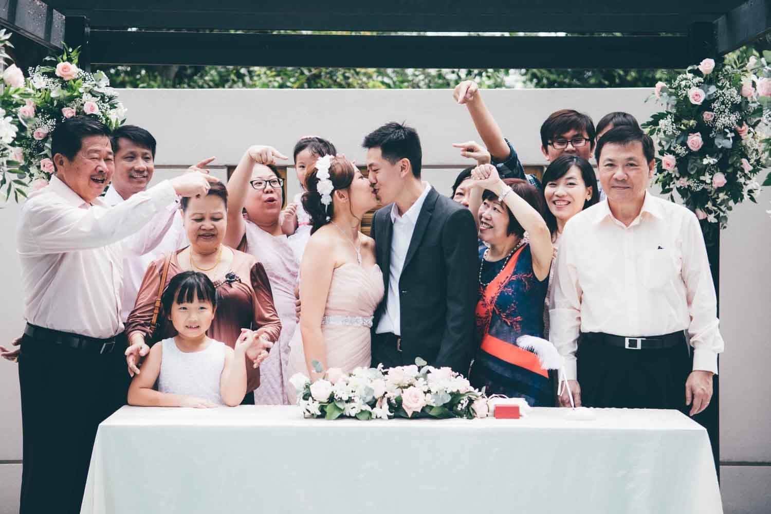 wedding group photo with family by professional wedding rom solemisation photographer in singapore