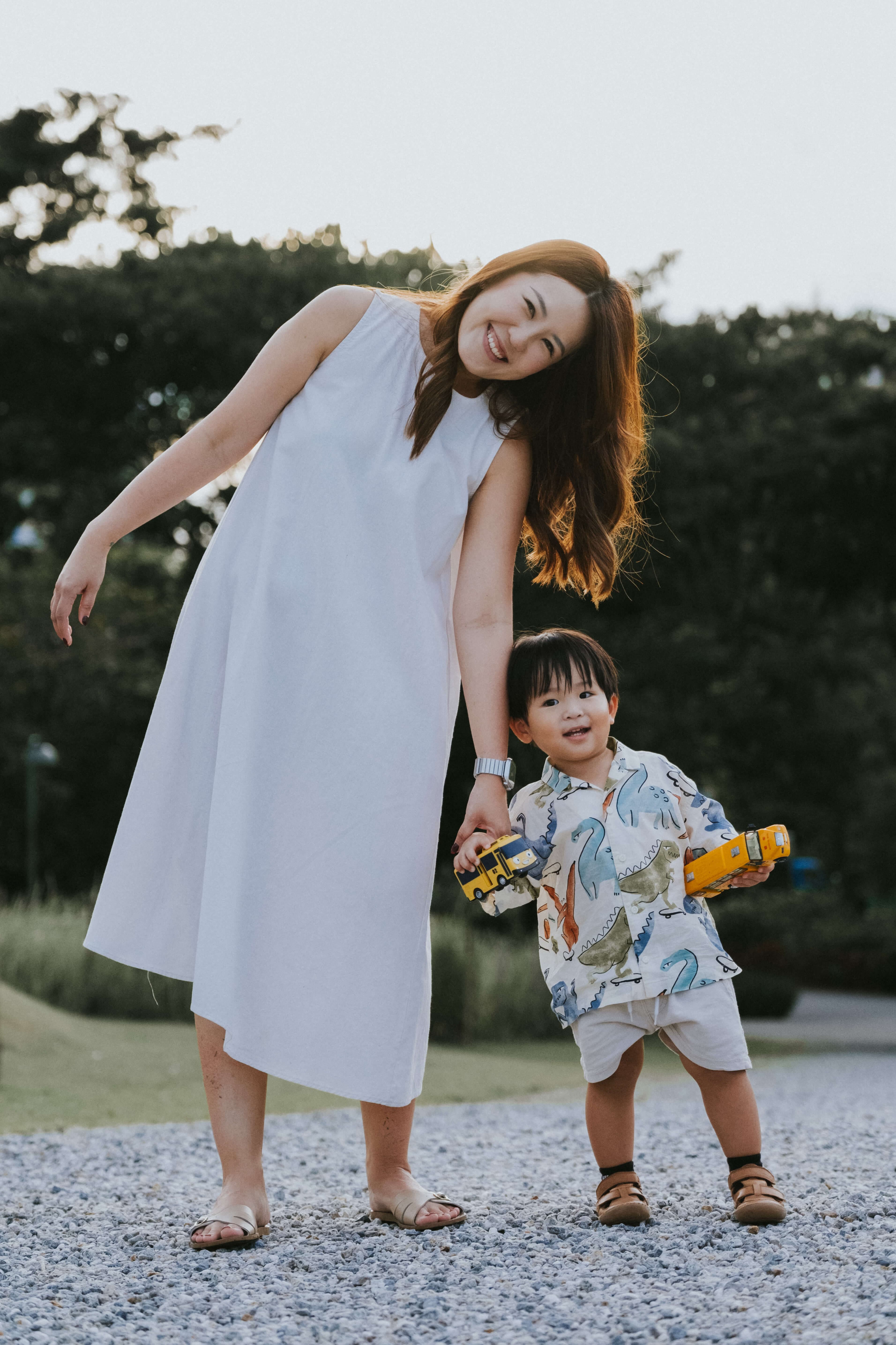 mother and son leaning towards each other during sunset during a family photoshoot at Jurong Lake Gardens