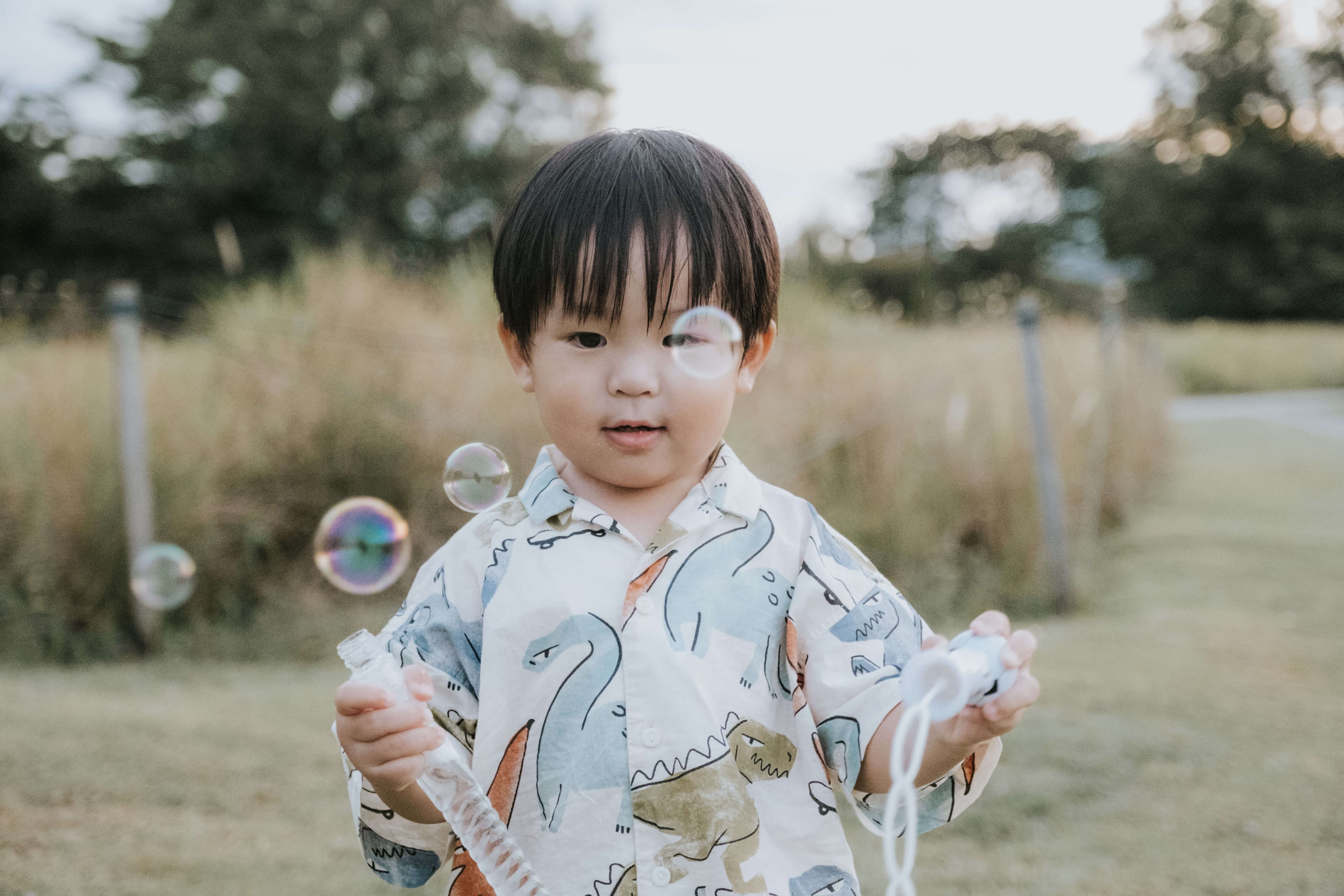 kid playing with bubbles at Jurong Lake Gardens in Singapore during a photo shoot